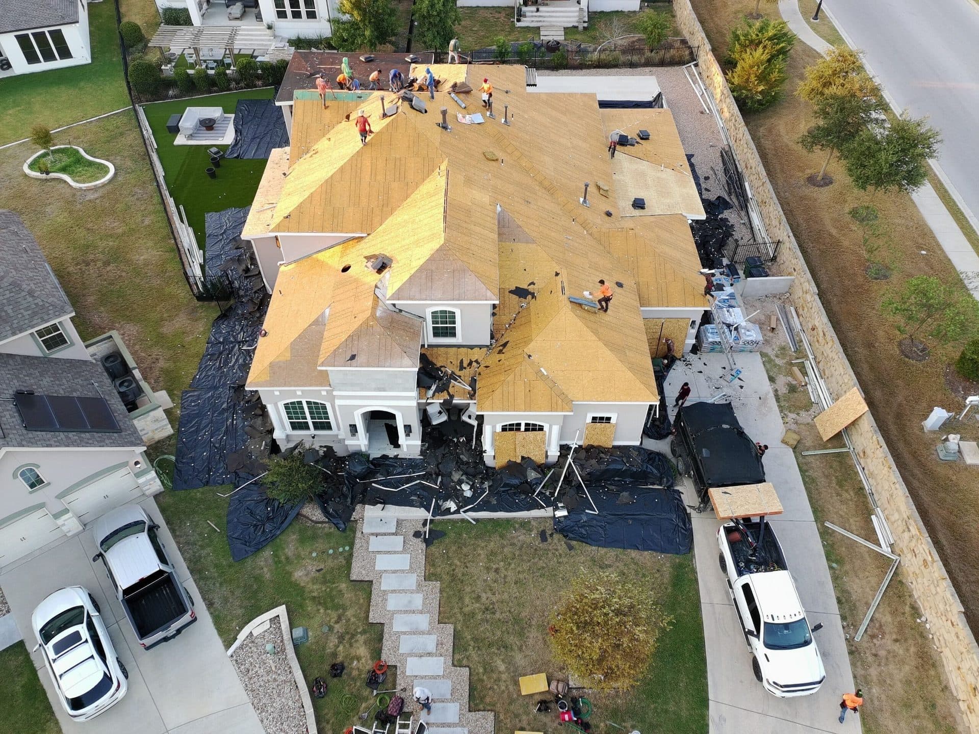 Tarrytown Roofing crew installing decking on a Leander residential reroof