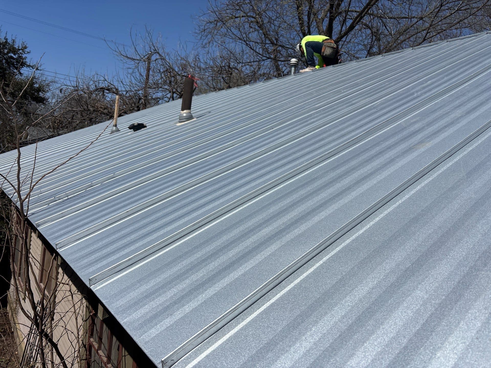 Standing-seam metal reroof at 4406 Speedway, Austin