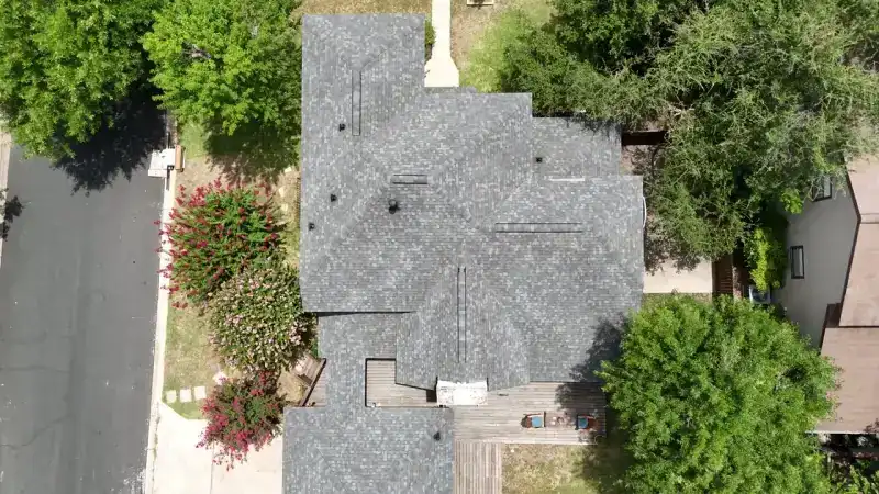 Aerial drone view over Austin roofline near the Tarrytown Roofing office