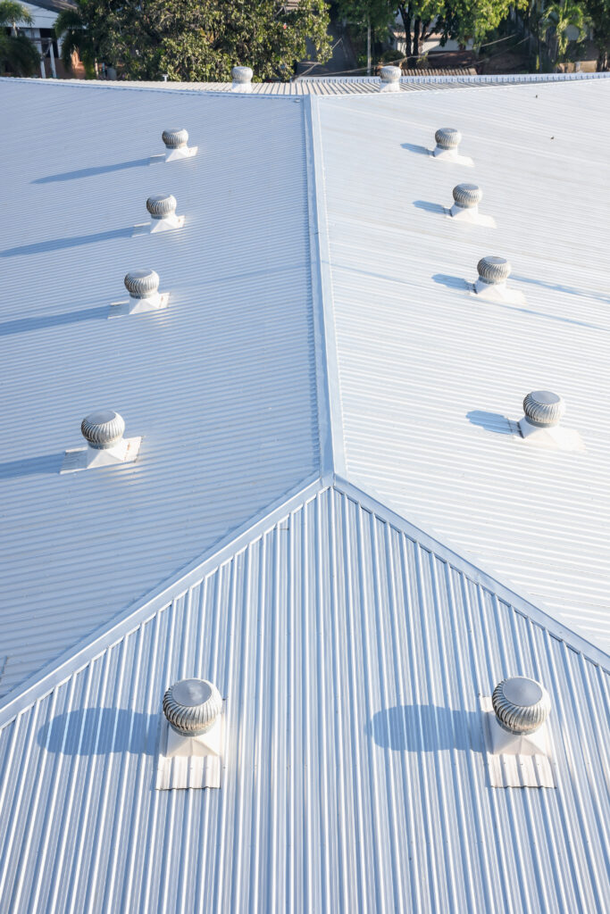 Commercial building in Austin Texas with white metal roof