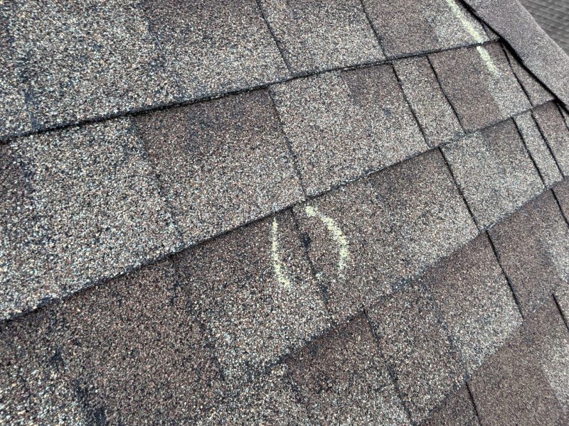 Hail damage with marketing, shingle roof.